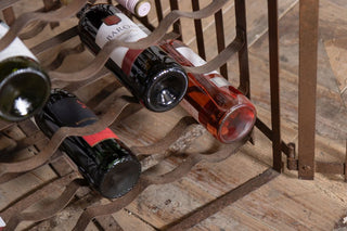 antique-iron-wine-rack-filled