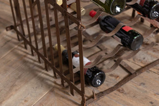 antique-iron-wine-rack-filled