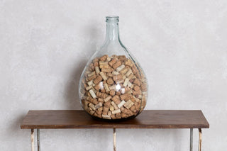 large carboy bottle with corks