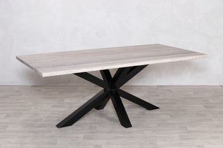 travertine-top-dining-table-black-star-base