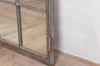 close up of cast iron mirrored window corner