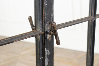 close up of cast iron mirrored window handle