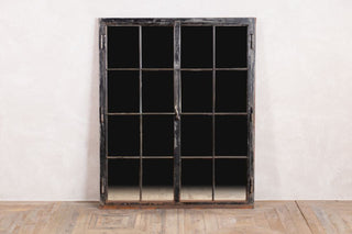 cast iron mirrored window