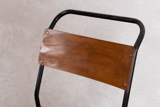 close up of plywood stacking chair back