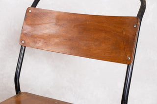 close up of plywood stacking chair back