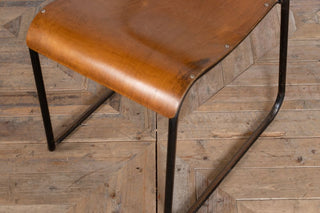 close up of plywood stacking chair legs