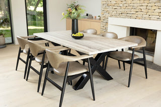travertine-top-dining-table-black-x-frame-base-lifestyle