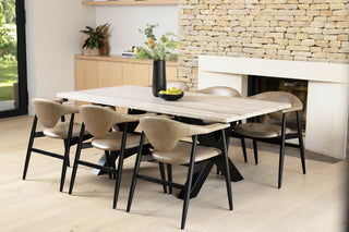 travertine-top-dining-table-black-x-frame-base-lifestyle