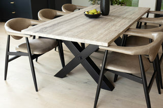 travertine-top-dining-table-black-x-frame-base-lifestyle
