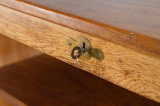 vintage wooden tambour cupboard key close up