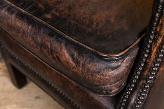 antique brown leather armchair