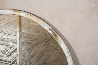 arched mirrored window