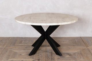 round-dining-table-with--tank-trap-base