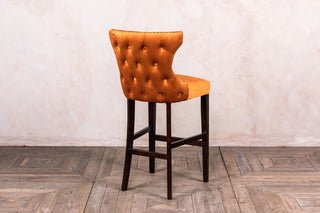 burnt orange button back stool