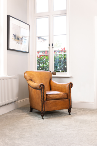 tan-armchair-by-window