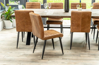 group-of-tan-chairs-around-table