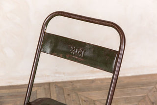 green metal folding chair