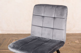 grey button back chair