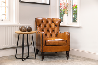 chesterfield-style-tan-armchair-in-home