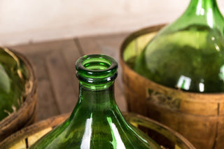 large vintage wine bottle with bucket