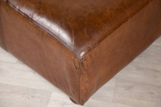 vintage-leather-footstool-pouf-corner