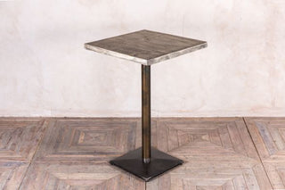 metal-pedestal-table-with-oiled-top