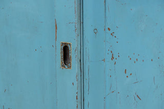 vintage-large-pine-sliding-door-cupboard-with-pigeonholes-close-up