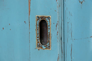 vintage-large-pine-sliding-door-cupboard-with-pigeonholes-close-up