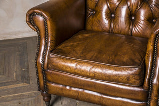 tan leather armchair
