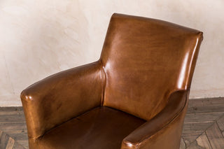 tan leather armchair