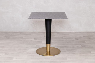 dark-terrazzo-table-round-brass