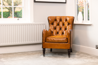 chesterfield-style-tan-armchair-in-home
