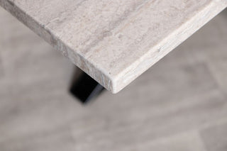 travertine-top-dining-table-gunmetal-star-base