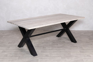 travertine-top-dining-table-black-x-frame-base