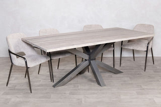 travertine-top-gunmetal-star-based-dining-table