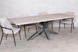 travertine-top-gunmetal-star-based-dining-table
