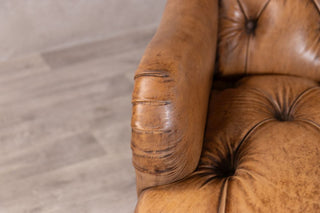 tan leather armchair
