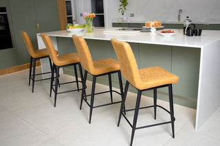 woodstock-faux-leather-stools-harvest-gold-in-kitchen