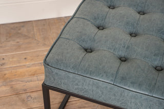 worn denim leather footstool