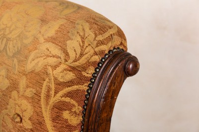 studded upholstered armchair