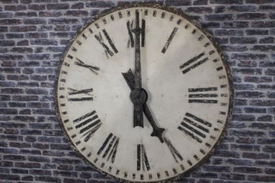 large distressed clock face