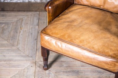 high backed tan leather armchair