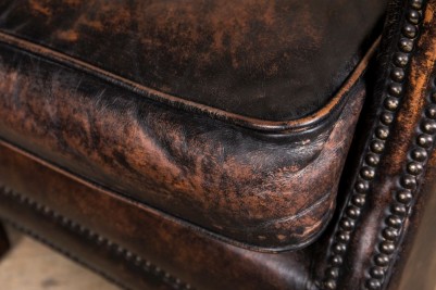worn leather look armchair