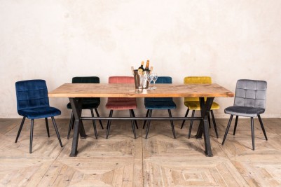 modern rustic dining table and velvet chairs