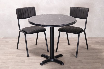 alcantara-black-round-top-with-x-bottom-base-and-chairs