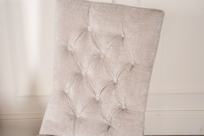 grey upholstered button back chair