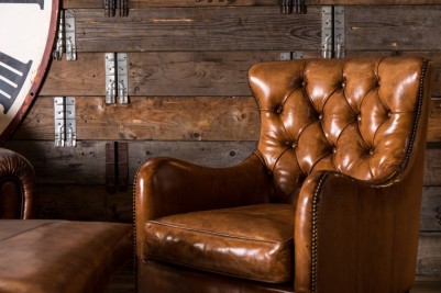 brown leather button back armchair