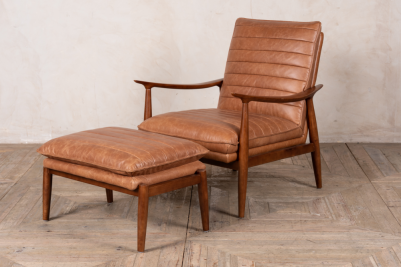 tan leather chair and footstool