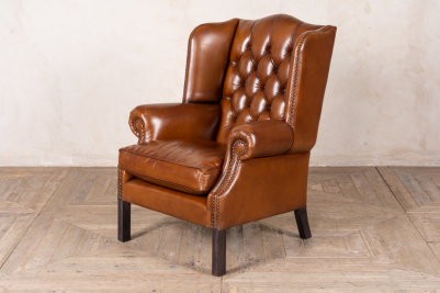 tan chesterfield style armchair