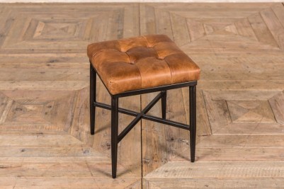 small tan footstool